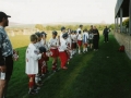 The teams line up before the last game to exchange gifts.