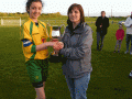 Captain Chloe O\'Keeffe accepts the cup from Kathleen Broderick LDSL-GL