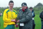 Anthony Forde receives his Man of the Match award from LDFL P.R.O. Frank Nelligan.